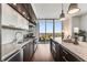 Modern kitchen with stainless steel appliances, custom cabinetry, and a large island perfect for entertaining overlooking scenic views at 1820 Peachtree Nw St # 1215, Atlanta, GA 30309