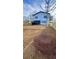 View of backyard with a new fence and the rear exterior of the house at 3128 Cedar St, Scottdale, GA 30079