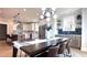 Dining area with open layout, seamlessly connected to a modern kitchen and ample counter seating at 3128 Cedar St, Scottdale, GA 30079