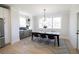 Bright dining room features a table with seating for six with a view to the backyard at 3128 Cedar St, Scottdale, GA 30079