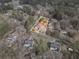 Aerial view of home and property, highlighting the mature trees and surrounding neighborhood at 3566 Dorris Cir, Douglasville, GA 30135