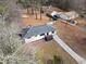 Aerial view of home featuring a deck, well-maintained lawn, and nearby outbuildings at 3566 Dorris Cir, Douglasville, GA 30135