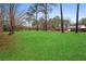 Beautiful backyard with a pristine green lawn, providing a serene and spacious outdoor area at 3566 Dorris Cir, Douglasville, GA 30135