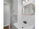 Bathroom featuring white vanity with storage, sink, black faucet, and a decorative mirror at 3566 Dorris Cir, Douglasville, GA 30135