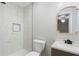 Modern bathroom features neutral tile, shower stall, sleek fixtures, and attractive mirror at 3566 Dorris Cir, Douglasville, GA 30135