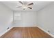 Bright bedroom features hardwood floors, fresh paint, and a double-hung window at 3566 Dorris Cir, Douglasville, GA 30135