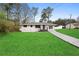 Inviting one-story home with green lawn, newly painted exterior, and charming front porch at 3566 Dorris Cir, Douglasville, GA 30135