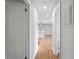 Hallway view showcasing the hardwood floors and the connection to the living area at 3566 Dorris Cir, Douglasville, GA 30135