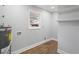 Utility room features vinyl flooring, a window, and shelving for extra storage at 3566 Dorris Cir, Douglasville, GA 30135