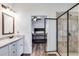 Bathroom flows into the bedroom with a tiled shower and vanity at 429 Mulberry Rock Road, Temple, GA 30179