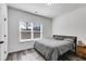 Cozy bedroom with natural light, neutral decor, and wood-look flooring at 429 Mulberry Rock Road, Temple, GA 30179