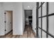 Inviting foyer with wood-look flooring, white walls, and a view into the home's open-concept living space at 429 Mulberry Rock Road, Temple, GA 30179