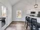 View of the kitchen with a bar, stainless steel appliances, and a view of the backyard at 429 Mulberry Rock Road, Temple, GA 30179