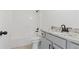 Bathroom featuring white cabinets, granite countertops and a shower-tub combo at 472 Price Rd, Carrollton, GA 30116