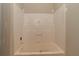 Bathroom featuring a bright white built-in bathtub and shower at 472 Price Rd, Carrollton, GA 30116