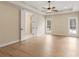 Spacious bedroom with hardwood floors, recessed lighting, ceiling fan, and ensuite bathroom at 472 Price Rd, Carrollton, GA 30116
