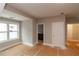 Bedroom with natural light and a view to the ensuite bathroom and walk-in closet at 472 Price Rd, Carrollton, GA 30116