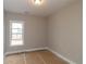 Bedroom with neutral paint, white trim, and a bright window at 472 Price Rd, Carrollton, GA 30116