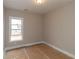 Bedroom featuring neutral paint, white trim, and a window at 472 Price Rd, Carrollton, GA 30116