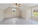 Bright bedroom with plush carpet, large windows, and neutral paint at 472 Price Rd, Carrollton, GA 30116