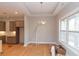 Dining room featuring a modern chandelier and large windows at 472 Price Rd, Carrollton, GA 30116