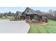 Beautiful home boasts of charming curb appeal with a covered entryway, green grass and circular driveway at 472 Price Rd, Carrollton, GA 30116