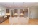 A view of the kitchen featuring wood cabinets, pendant lights, and a central island awaiting finishing touches at 472 Price Rd, Carrollton, GA 30116