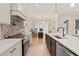 Stylish kitchen with a center island, stainless steel appliances, and office area at 472 Price Rd, Carrollton, GA 30116