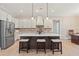 Spacious kitchen with a center island, white cabinetry, and stainless steel appliances at 472 Price Rd, Carrollton, GA 30116