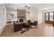 Cozy living room with a brick fireplace, built-in bookshelves, and comfortable seating at 472 Price Rd, Carrollton, GA 30116