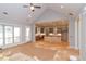 Open living space showcasing a kitchen, vaulted ceilings, and large windows, creating a modern and airy ambiance at 472 Price Rd, Carrollton, GA 30116