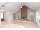 Spacious living room with a brick fireplace, high ceilings, and ample natural light, creating a warm atmosphere at 472 Price Rd, Carrollton, GA 30116