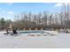 Luxurious swimming pool with ample lounge seating, perfect for relaxation at 472 Price Rd, Carrollton, GA 30116