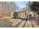 Beautifully landscaped backyard with wooden fence and stepping stone pathway at 11180 West Rd, Roswell, GA 30075