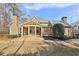 Well-manicured backyard features a covered patio at 11180 West Rd, Roswell, GA 30075
