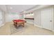 Finished basement featuring pool table, wet bar and tiled floors at 11180 West Rd, Roswell, GA 30075