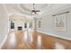 Bedroom with decorative trey ceiling, fireplace, and a ceiling fan at 11180 West Rd, Roswell, GA 30075