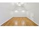 Bonus room boasts an elegant, vaulted ceiling and gorgeous hardwood floors at 11180 West Rd, Roswell, GA 30075