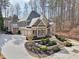 Luxury home with manicured front yard and multi-car garage at 11180 West Rd, Roswell, GA 30075
