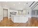 Bright kitchen featuring a center island, stainless steel appliances, and hardwood floors at 11180 West Rd, Roswell, GA 30075