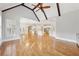 Living room has hardwood floors, a ceiling fan, and cathedral ceiling at 11180 West Rd, Roswell, GA 30075