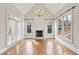 Living room features a fireplace, hardwood floors, and lots of natural light at 11180 West Rd, Roswell, GA 30075