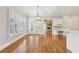 Living room has a cathedral ceiling, hardwood floors, and natural light at 11180 West Rd, Roswell, GA 30075