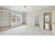 Spacious main bedroom featuring large windows and built-in shelving at 11180 West Rd, Roswell, GA 30075