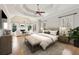 Main bedroom with trey ceilings, sitting area with fireplace, and large windows at 11180 West Rd, Roswell, GA 30075