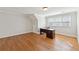 Bright office space featuring hardwood floors and natural light from large windows at 11180 West Rd, Roswell, GA 30075