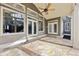 Covered outdoor patio with beautiful stone flooring is perfect for relaxing at 11180 West Rd, Roswell, GA 30075
