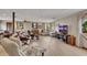 Spacious finished basement with laminate floors, a seating area, and a large window with a view of the trees at 2731 Tritt Springs Ne Dr, Marietta, GA 30062