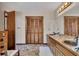 Bathroom features wood-look tile floors, a double sink vanity and an ample amount of cabinet space at 2731 Tritt Springs Ne Dr, Marietta, GA 30062