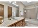 Bright bathroom with a tile countertop, a skylight, and a shower-tub combination at 2731 Tritt Springs Ne Dr, Marietta, GA 30062